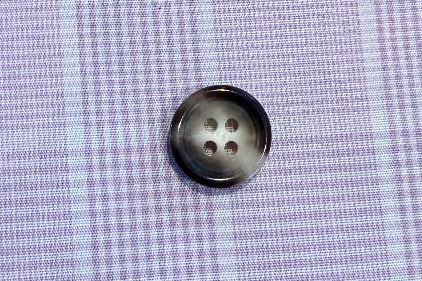 button on plaid fabric