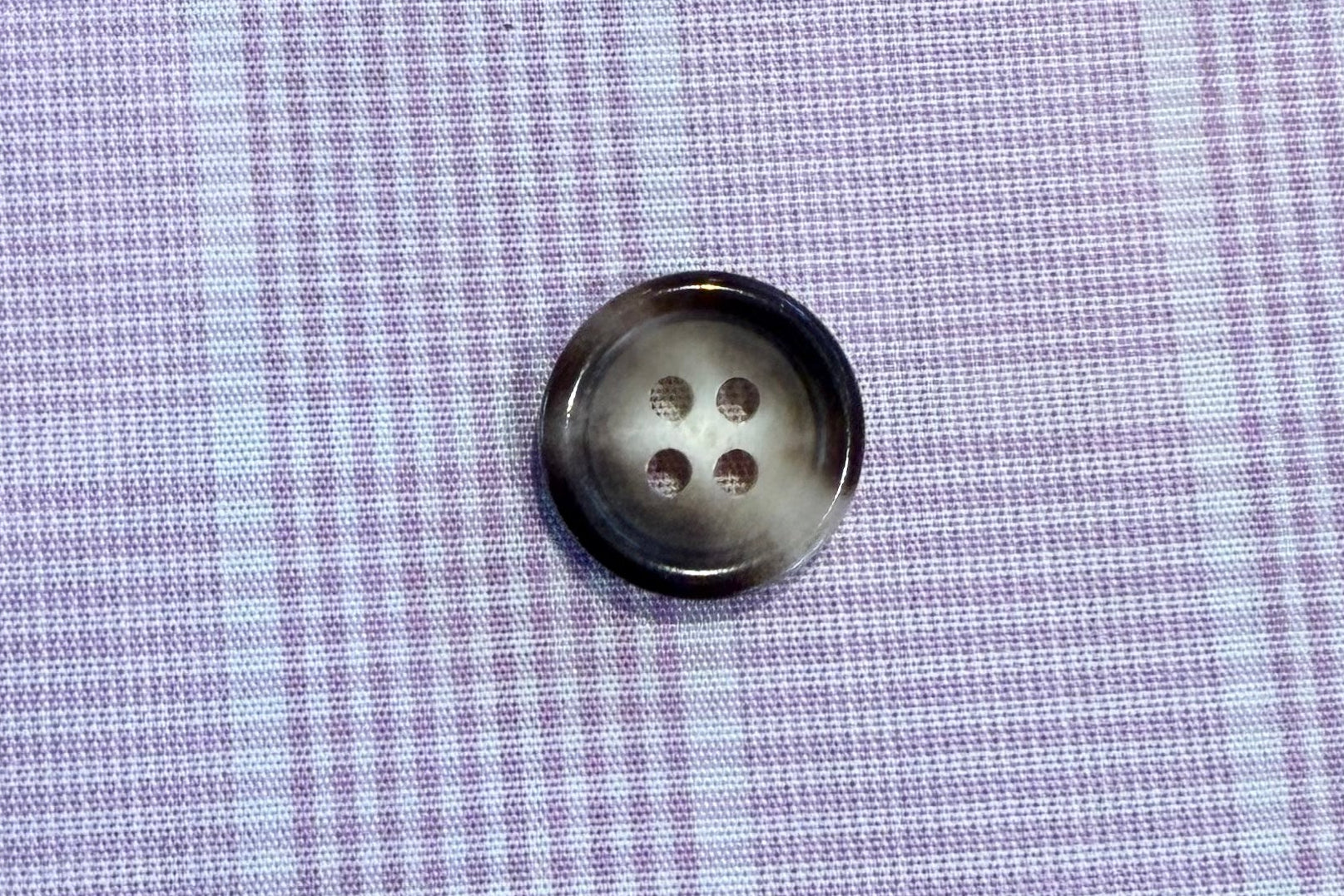 button on plaid fabric