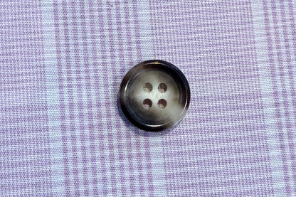 button on plaid fabric