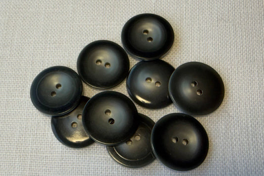 Grey buttons on a textured gray surface