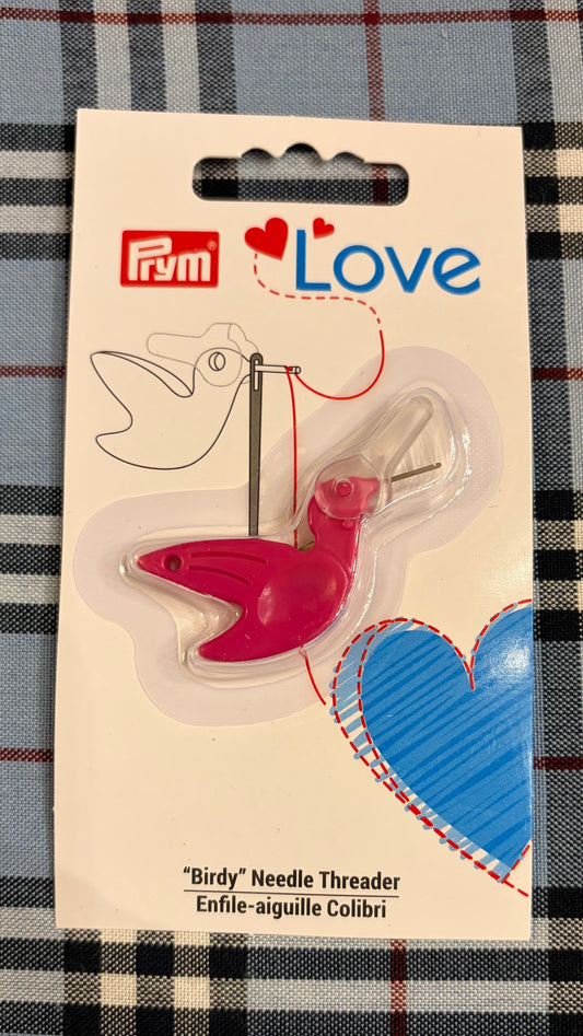  Prym Love bird-shaped needle threader on a plaid background