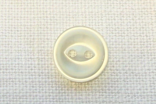 Small white button with on a textured fabric background